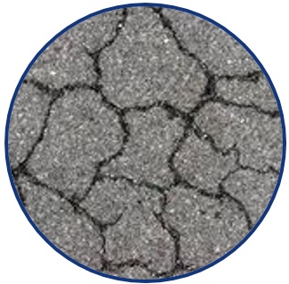 Picture of a close-up view of severely cracked asphalt pavement. The picture is a logo symbolizing the research theme of: “Enhancing Durability and Service Life of Infrastructure”.